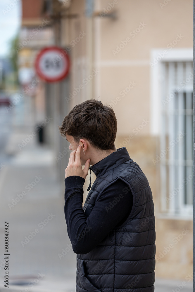 young man posing in the street young man posing in the street