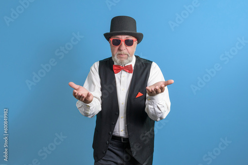 The holiday is coming. Invite to a party. Light blue background. Iimposing elderly man calls for an event.