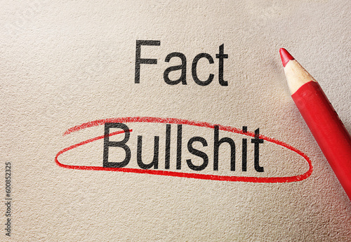 Bullshit circled in red pencil below Fact text, on textured paper