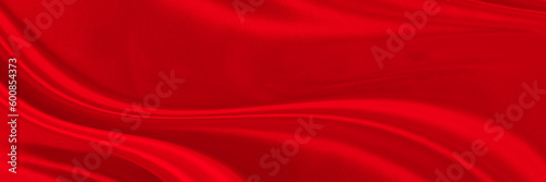 Black red satin dark fabric texture luxurious shiny that is abstract silk cloth background with patterns soft waves blur beautiful.