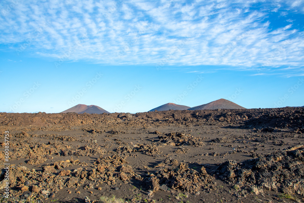 cold lava in detail in Timanfaya national park in Lanzarote with crater landscape