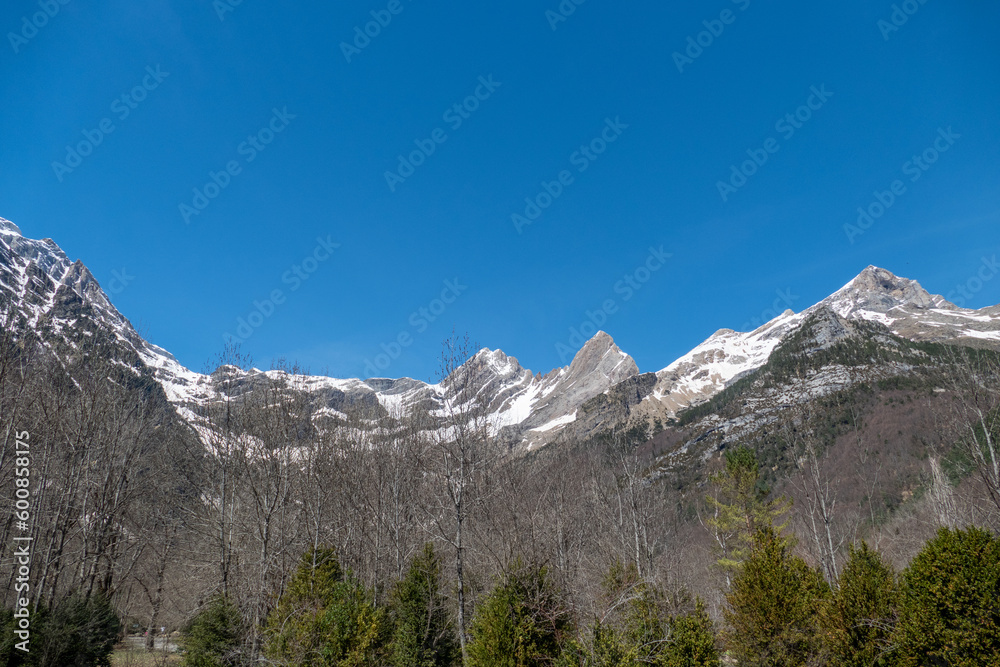 Twin peaks of Punta Felqueral and Pico Pineta in winter seen from the Pineta Valley ,Ordesa and Monte Perdido National Park, Spain, Pyrenees