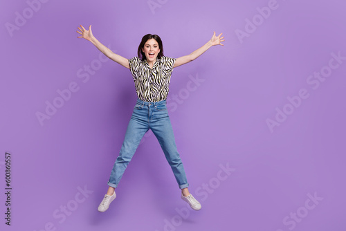 Full body portrait of sportive nice lady jumping raise hands make star figure empty space isolated on purple color background