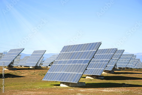 The solar panels are in the field. The theme is an alternative power source.