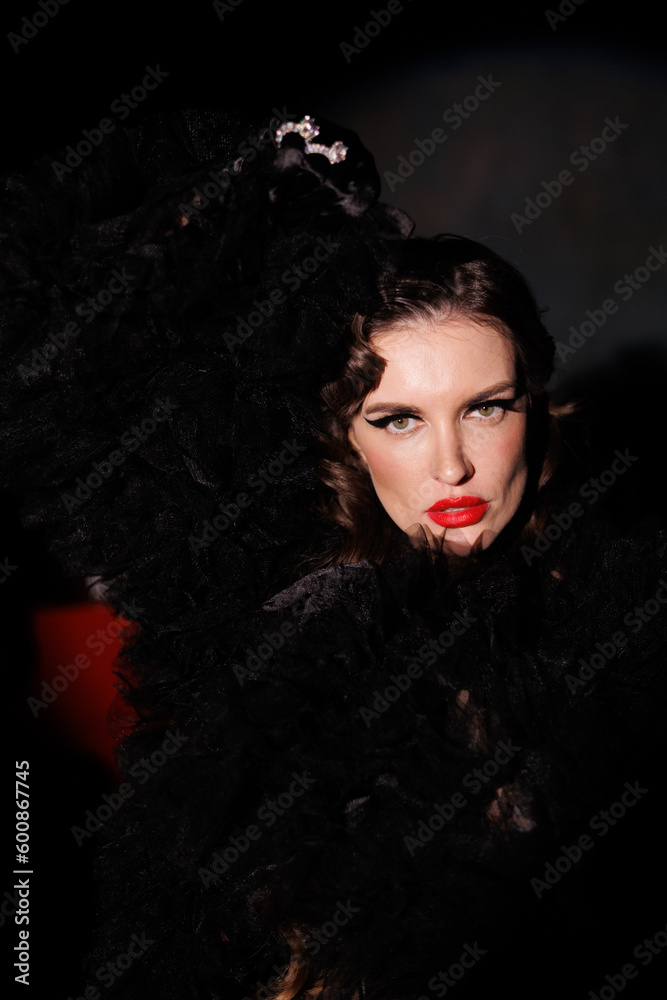Beautiful woman in retro style fashion black underwear and stockings, red lipstick, hairstyle. Red piano and round spot light, aperture. Girl portrait, porsh look, gloves Beautiful woman in retro style fashion black underwear and stockings, red lipstick, hairstyle. Red piano and round spot light, aperture. Girl portrait, porsh look, gloves