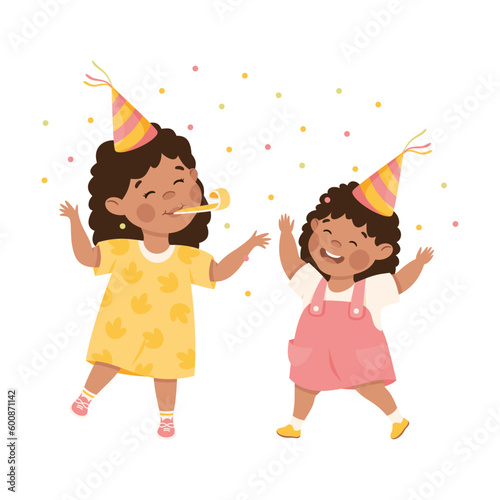 Happy girls in party hats celebrating birthday. Joyful kids sisters playing together cartoon vector illustration