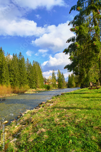 Beautiful spring panorama over river to snowy Witow, Tatra mountains, Poland