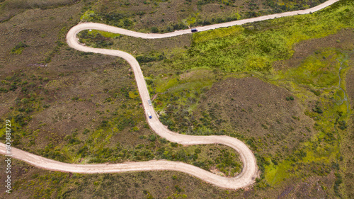 aerial view of winding road over the mountain