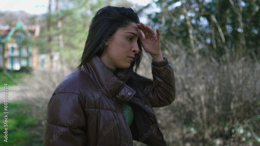 Suffering young woman leaning on tree outside feeling desperate. Adult girl in 20s covering face with shame and regret during difficult times Suffering young woman leaning on tree outside feeling desperate. Adult girl in 20s covering face with shame and regret during difficult times