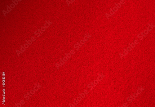 Photo of the background texture in red. Red felt piece of fabric. Soft-coated texture.
