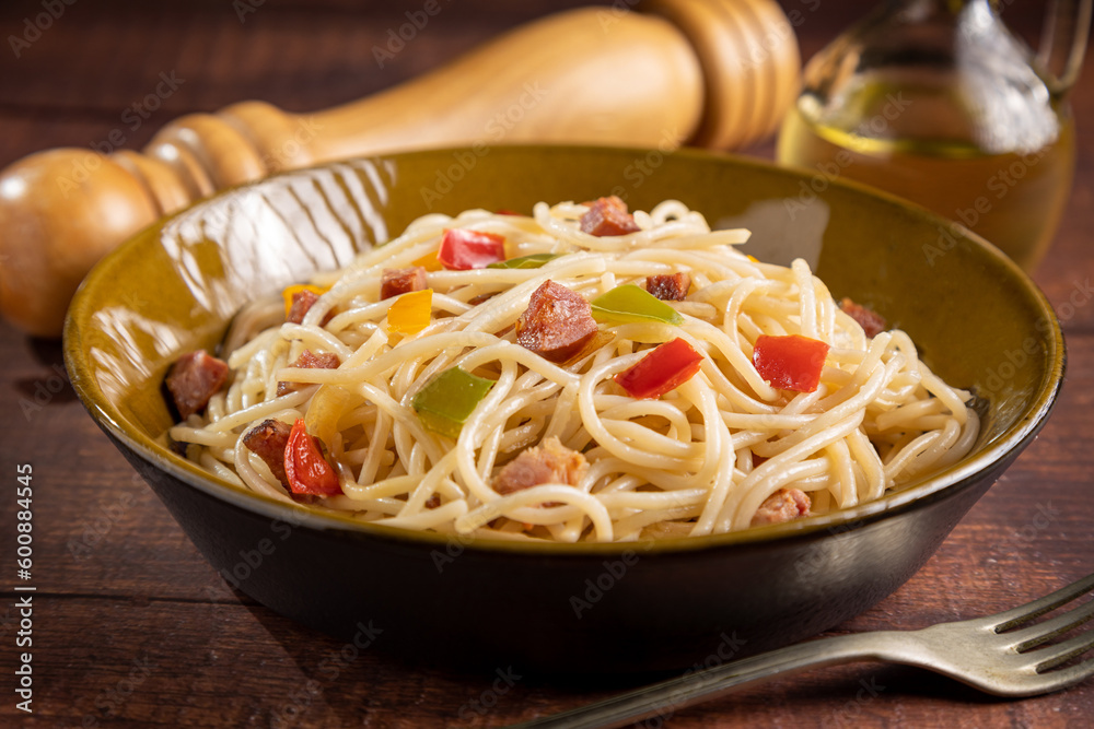 Plate with spaghetti, bacon and chopped vegetables. Plate with spaghetti, bacon and chopped vegetables.