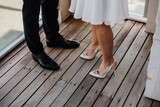 wedding details shoes bridal white sandals hands dress wedd ring bride and groom inspo hairstyles ceremony details