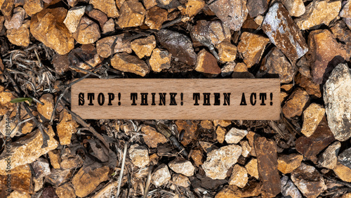 Stop Think Then act Written on wooden surface.