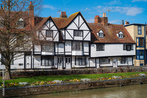 A Tudor style timber building on the bank of the river Stour in Canterbury, Kent, UK on a sunny spring day.