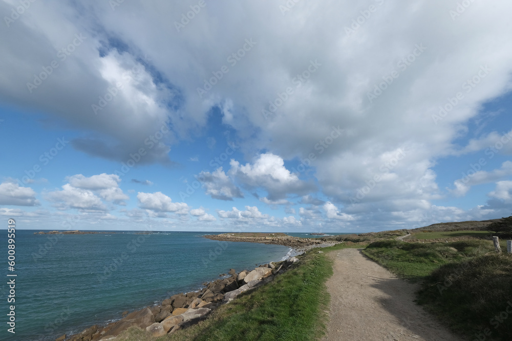Skies, shot with a wide-angle lens. 
Perspectives are distorted, and skies look wider and more dynamic. 

Shot from the French coast and its countryside.