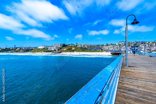 View of San Clemente beach and beachfront housing from the middle of the San Clemente Pier in Southern California © Nicole Padberg