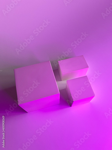 Mockup of products for skin or hair care. Abstract empty white podium on a pink background. Studio photo, top view