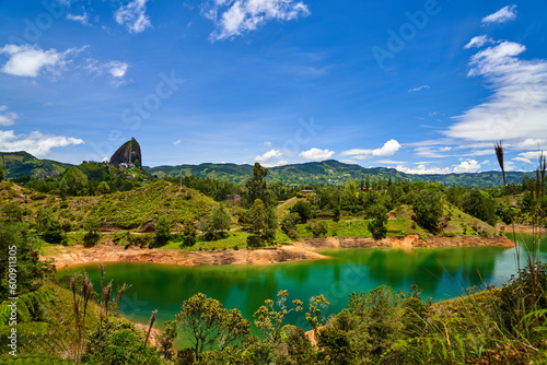 Scenic View of Rock of Guatap   with lake in the foreground   Embalse Guatap   