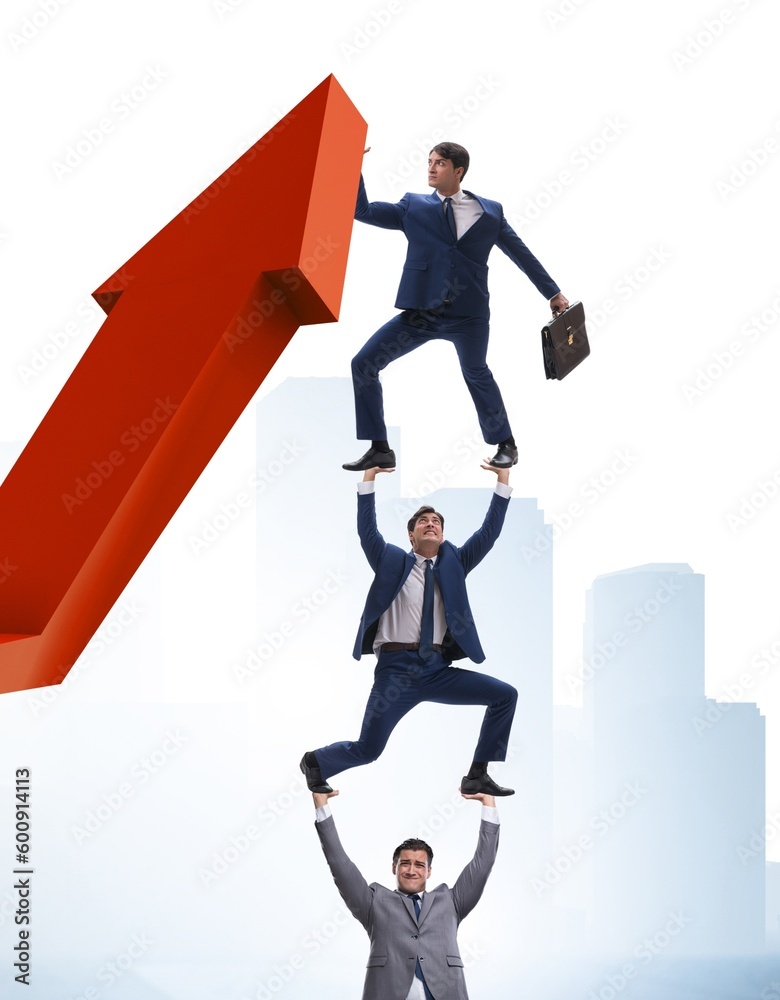 Businessman supporting growtn in economy on chart graph Businessman supporting growtn in economy on chart graph