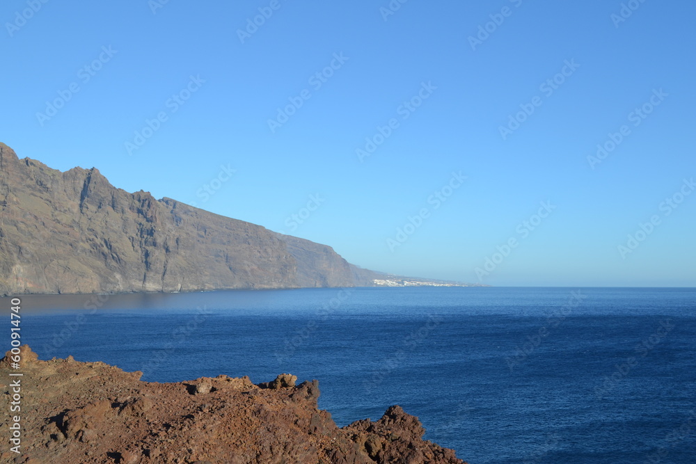 View of the lighthouse and beautiful rocks in the ocean on Tenerife. 