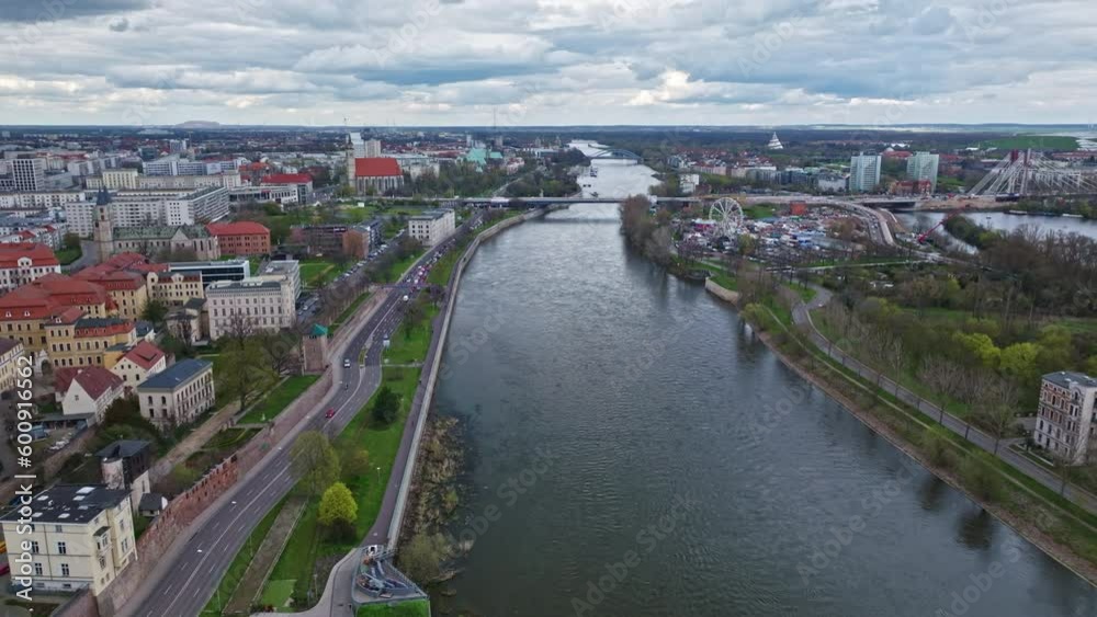 Drone shot revealing Elbe river and Power bridge (Strombrücke) , Magdeburg city , Germany . Drone shot revealing Elbe river and Power bridge (Strombrücke) , Magdeburg city , Germany .