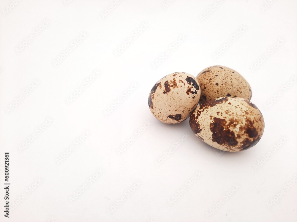 three quail eggs isolated on white background three quail eggs isolated on white background