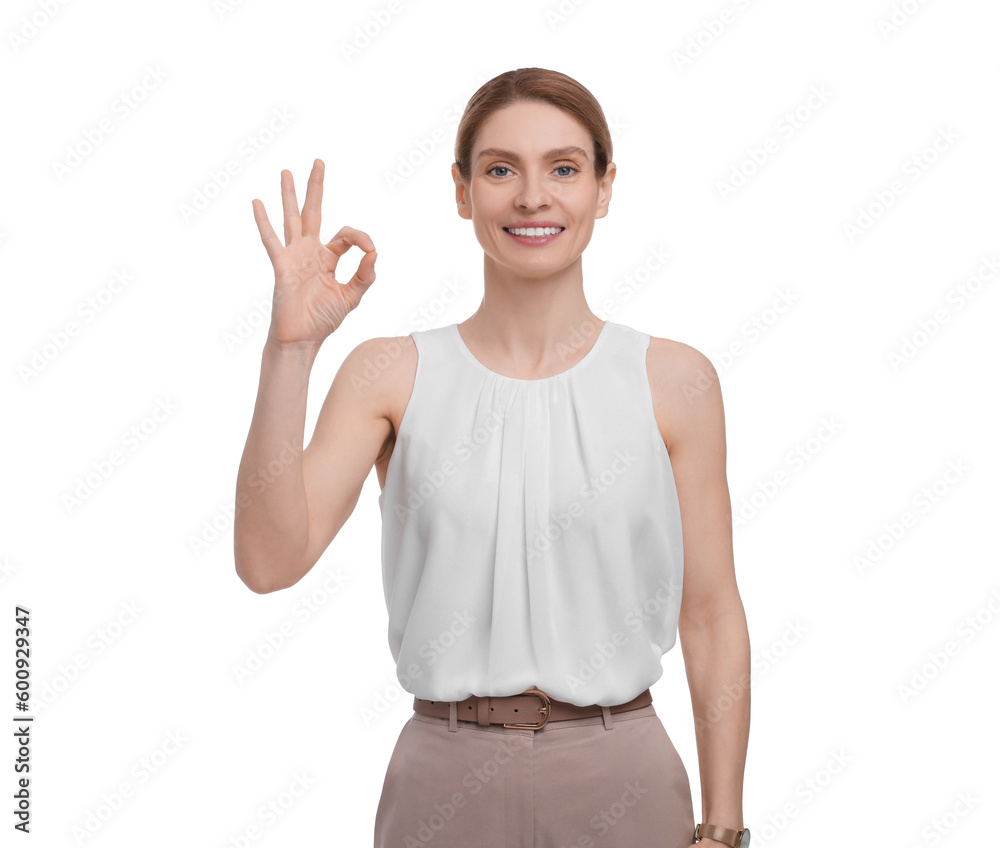 Beautiful happy businesswoman showing ok gesture on white background Beautiful happy businesswoman showing ok gesture on white background