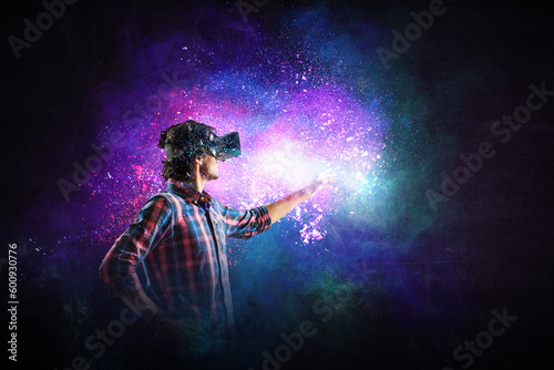 man wearing virtual reality goggles © Sergey Nivens