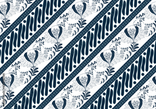 Batik Indonesian: is a technique of wax-resist dyeing applied to whole cloth, or cloth made using this technique originated from Indonesia. Batik is made either by drawing dots and lines