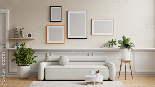 Mockup frames of various sizes on the wall of living room.3d rendering