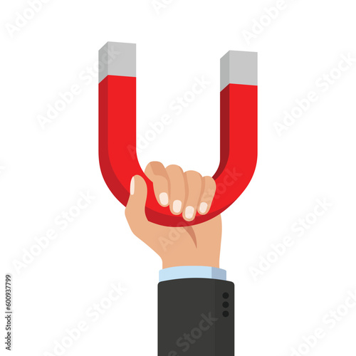 Businessman Hand Holds a Large Horseshoe Magnet Isolated on White Background