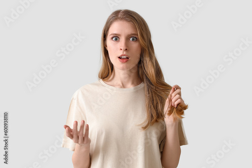 Shocked young woman with ha...