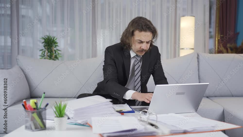 Stressed businessman works in his home office and his private life is not going well. Stressed businessman works in his home office and his private life is not going well.