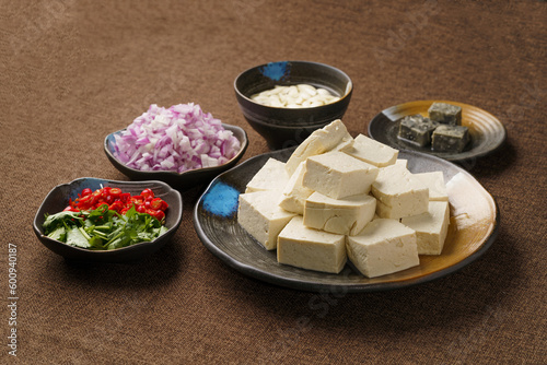 Ingredients required for fried stinky tofu on a monochrome background