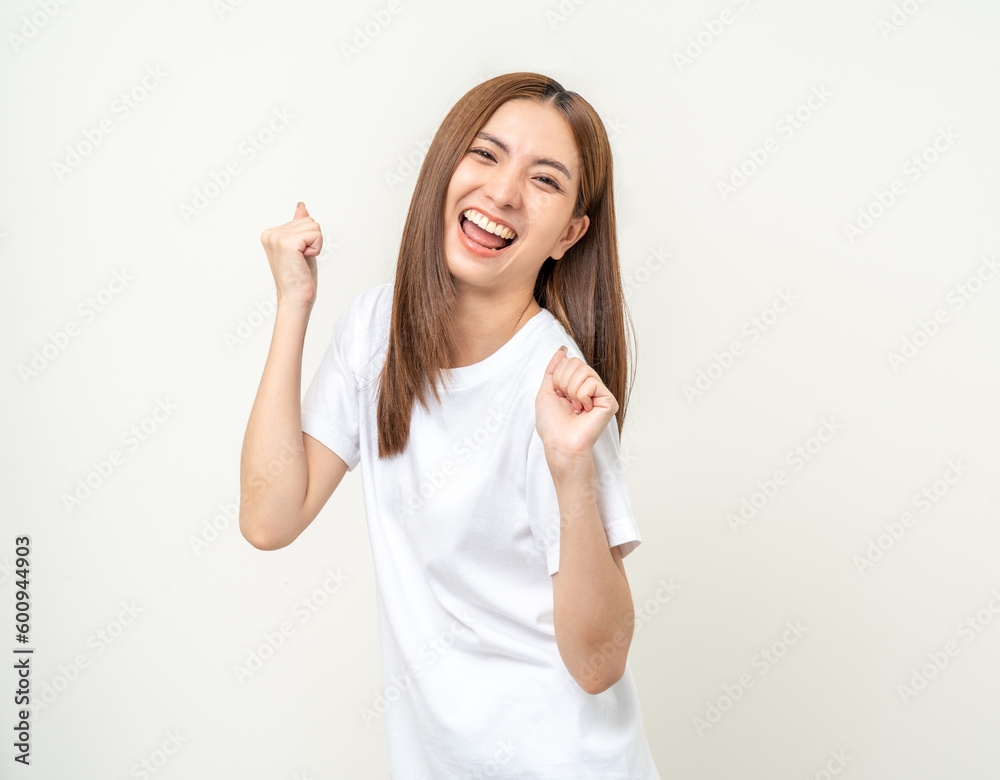Beautiful young asian woman age around 25 smiling. Charming female standing on isolated background. People pose Excited shocked face asian woman shout out loud wow Joyful winning victory challenge Beautiful young asian woman age around 25 smiling. Charming female standing on isolated background. People pose Excited shocked face asian woman shout out loud wow Joyful winning victory challenge