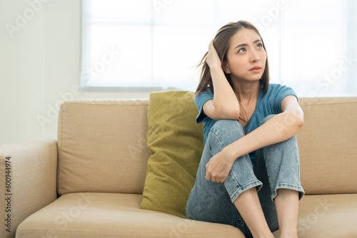 Depressed and Stressed asian woman on sofa. Crying sadness female alone in home problem in life. Unhappy asian woman headache Upset frustrated by problem love relationship feeling despair and anxiety Free Download Depressed and Stressed asian woman on sofa. Crying sadness female alone in home problem in life. Unhappy asian woman headache Upset frustrated by problem love relationship feeling despair and anxiety - GFXLoad