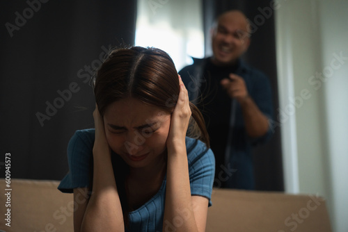 Relationships problems conflicts in marriage. Depressed stressed violence young couple man and woman Argument fighting shouting in the house. Making decision of breaking up get divorced. Harassment