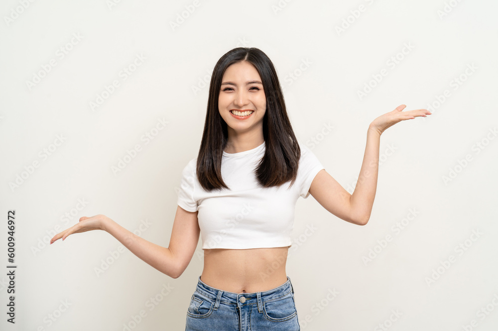 Beautiful smiling happy young asian woman in white shirt. Charming female lady open hands palm up holding something on isolated white background. Asian cute Pretty people looking copy space. Beautiful smiling happy young asian woman in white shirt. Charming female lady open hands palm up holding something on isolated white background. Asian cute Pretty people looking copy space.