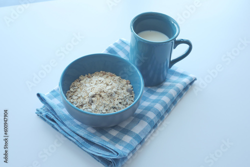  corn flakes and milk for morning breakfast on table .