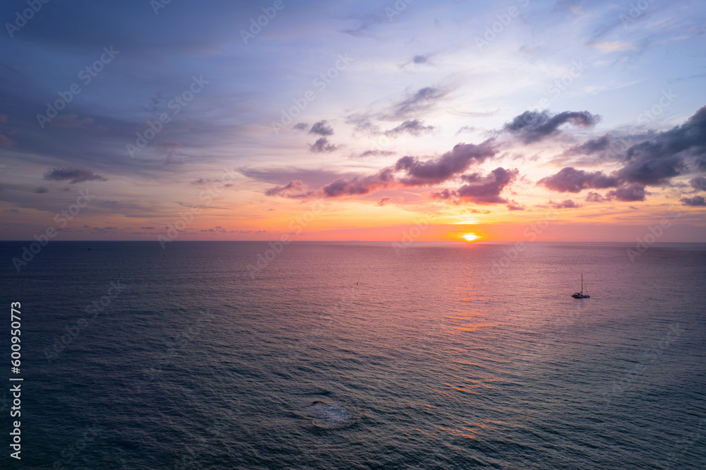 Obraz premium Sky view at sunset with ocher color over the sea, amazing view on the island.