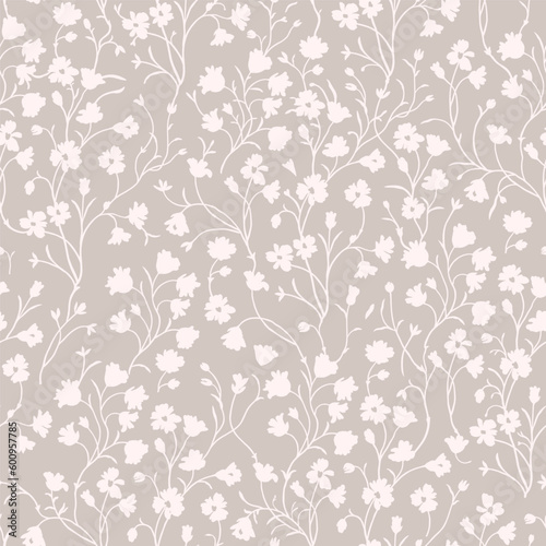 Spring floral pattern of light beige flowers and twigs on a beige background.