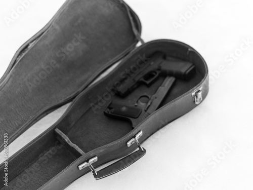 pistols in violin case © vectorass
