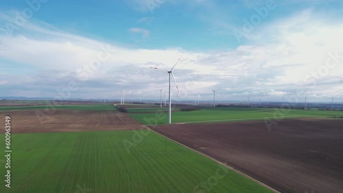 Aerial View of Wind Turbines in Colorful Farming Fields, Green Energy Concept, Dtone Shot photo