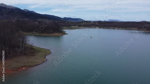 Drone footage of lake and people riding water bikes | 4K photo