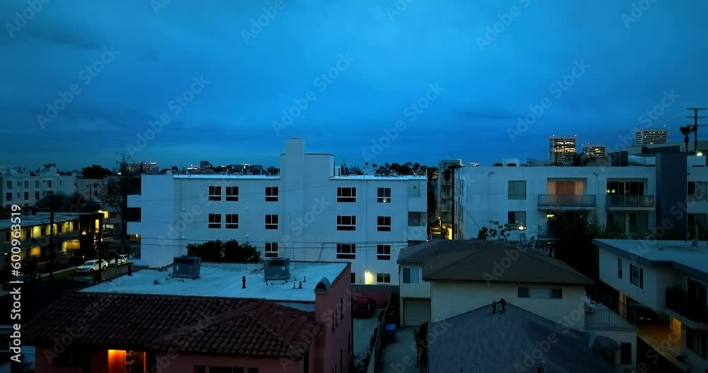 Early morning of blue hour sky in Century City aerial rising above apartments Early morning of blue hour sky in Century City aerial rising above apartments