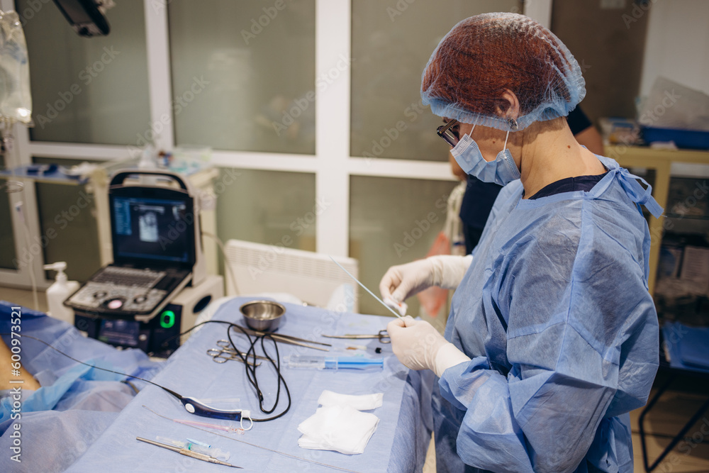 Group of surgeons wearing safety masks performing operation. Medicine concept Group of surgeons wearing safety masks performing operation. Medicine concept