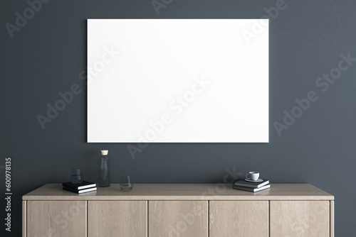 Modern wooden TV shelf with items and empty white mock up poster on dark wall background. Interior design and living room with place for advertisement concept. 3D Rendering.