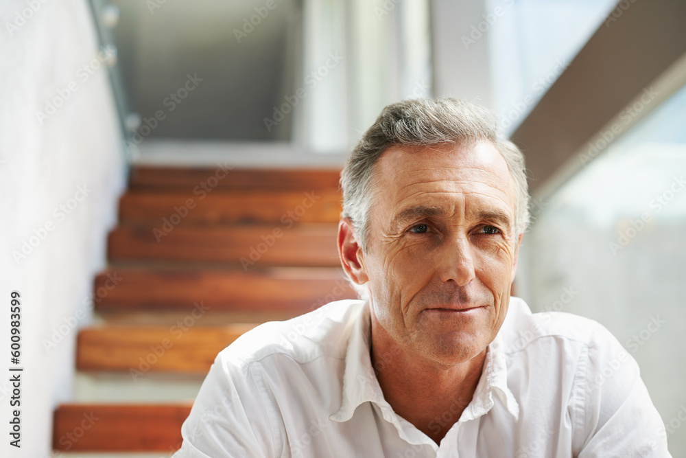 Thinking, steps and man in retirement at home with memories and sitting. Memory, relax and mature male person in a household alone with ideas and day dreaming about future and past in a house Thinking, steps and man in retirement at home with memories and sitting. Memory, relax and mature male person in a household alone with ideas and day dreaming about future and past in a house