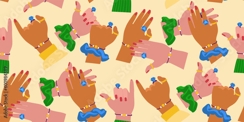 A pattern from the hands of friends with the same costume jewelry as a symbol of eternal friendship. Hands of support promises hand games love greetings. Printing on textiles and paper. Gift wrapping