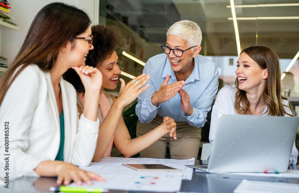 Group of successful happy multiethnic business people working as a team in office on meeting. Group of successful happy multiethnic business people working as a team in office on meeting.